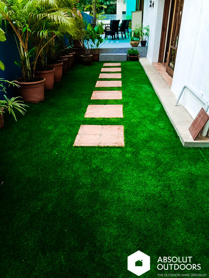 Artificial grass with recycled floor tiles