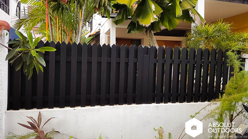 Wooden fence after repair and refurbishment